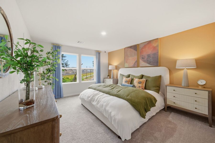 A bedroom with a large bed. A bedroom with a large bed.