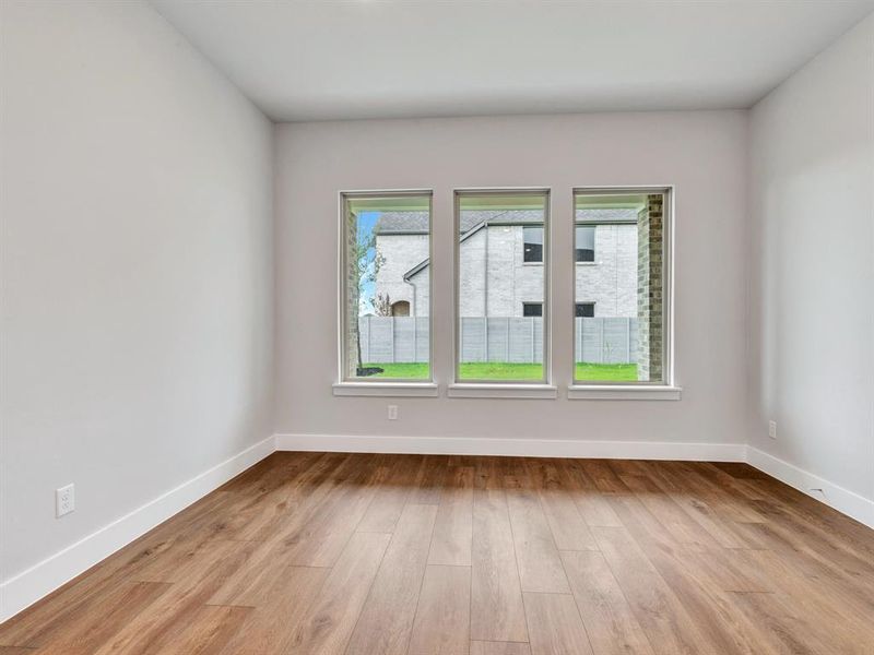 Spare room featuring light wood-type flooring