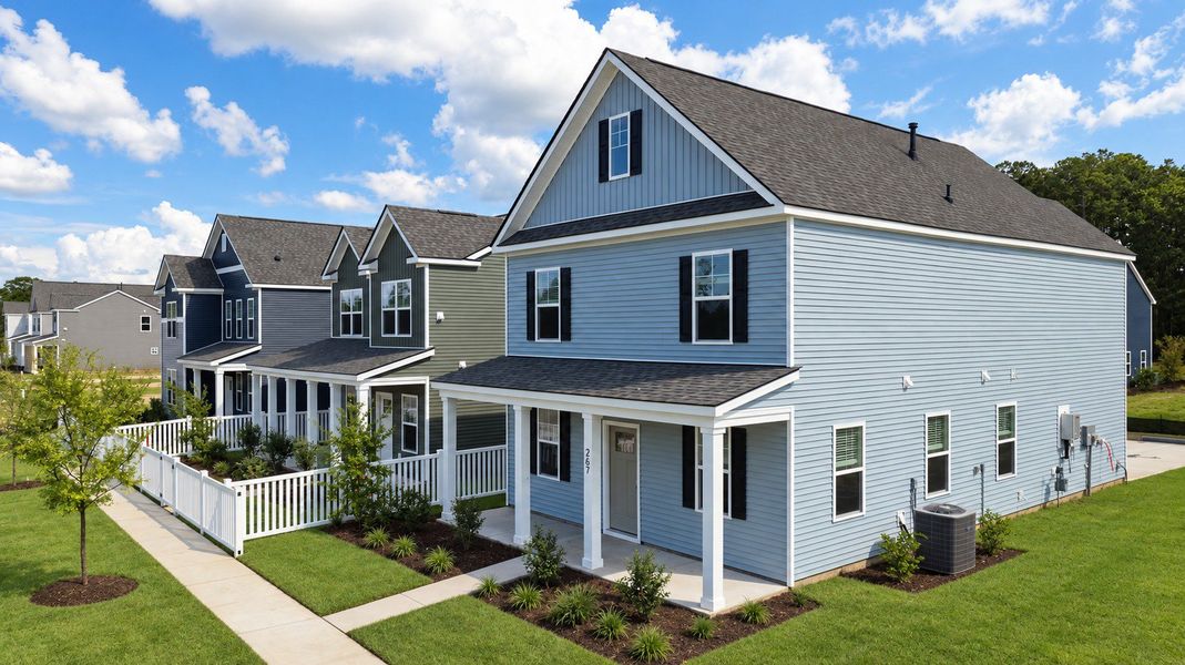 Front exterior of a new home in The Cove at Mallard Crossing, Summerville, SC, highlighting curb appeal (Image 10).