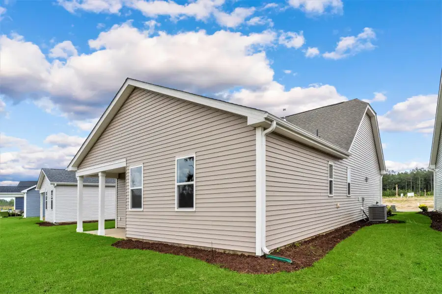 Exterior details and patio area of a home in Heritage Park at Longs, Longs (Image 3).