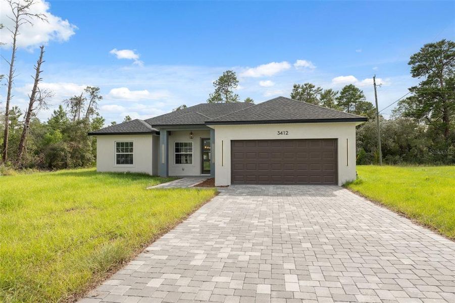 Front exterior of a new home in , Ocala, FL, highlighting curb appeal (Image 2).