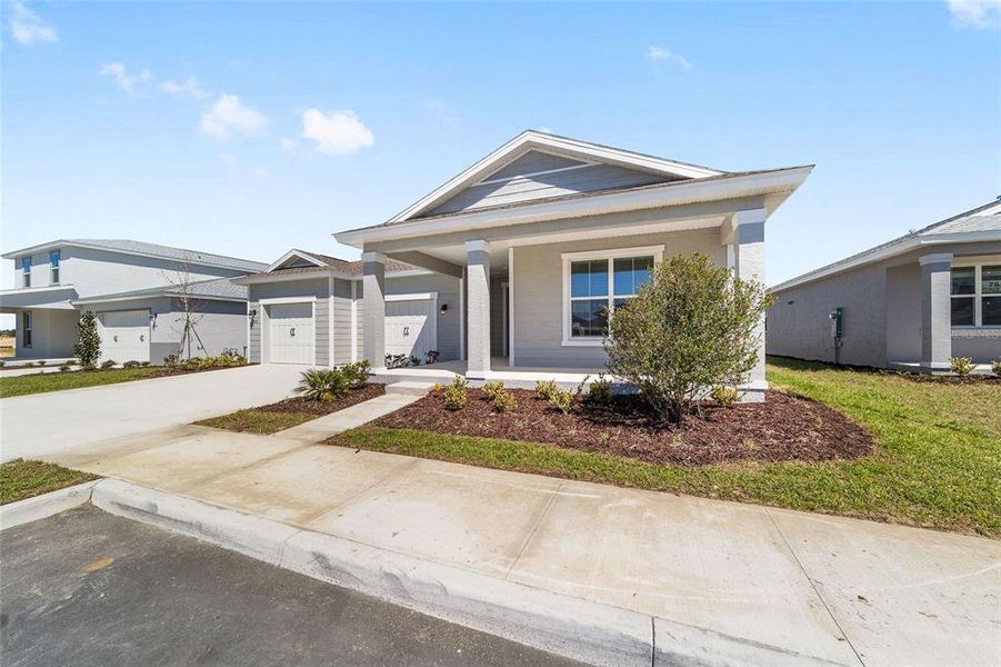 Front exterior of a new home in Calesa Township, Ocala, FL, highlighting curb appeal (Image 2). Front exterior of a new home in Calesa Township, Ocala, FL, highlighting curb appeal (Image 2).