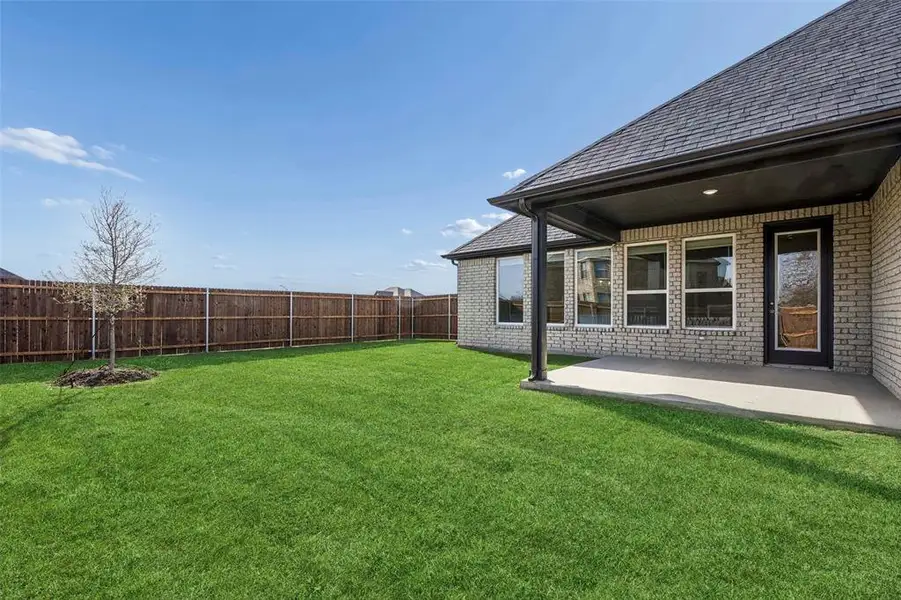 Exterior details and patio area of a home in Ten Mile Creek Estates, DeSoto (Image 4).