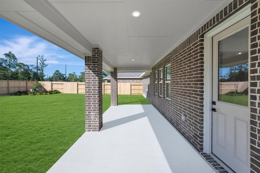 Relax outdoors on the large covered patio Relax outdoors on the large covered patio