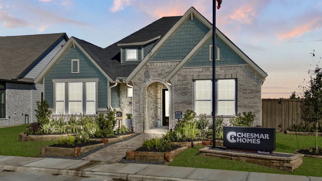 Front exterior of a new home in Riceland, Mont Belvieu, TX, highlighting curb appeal (Image 19).