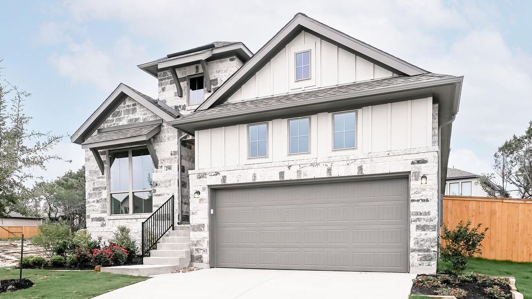 Front exterior of a new home in 6 Creeks, Kyle, TX, highlighting curb appeal (Image 11). Front exterior of a new home in 6 Creeks, Kyle, TX, highlighting curb appeal (Image 11).