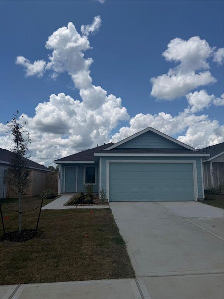 Front exterior of a new home in Avalon Ridge, Conroe, TX, highlighting curb appeal (Image 2).