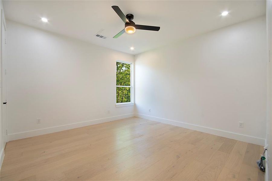 Spare room with light wood-style flooring, recessed lighting, and ceiling fan Spare room with light wood-style flooring, recessed lighting, and ceiling fan