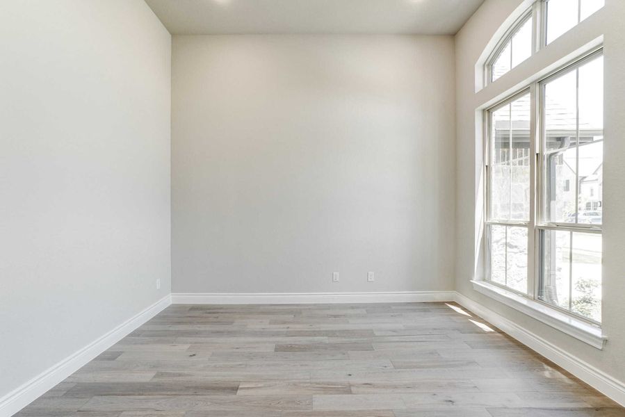 Representative unfurnished interior of a home built from the 2688 by Ravenna Homes in The Woodlands Hills 65′, Willis (Image 14).