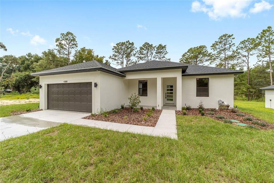 Front exterior of a new home in , Ocala, FL, highlighting curb appeal (Image 2).