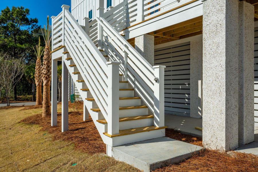 Exterior details and patio area of a home in Overlook at Copahee Sound, Awendaw (Image 41).