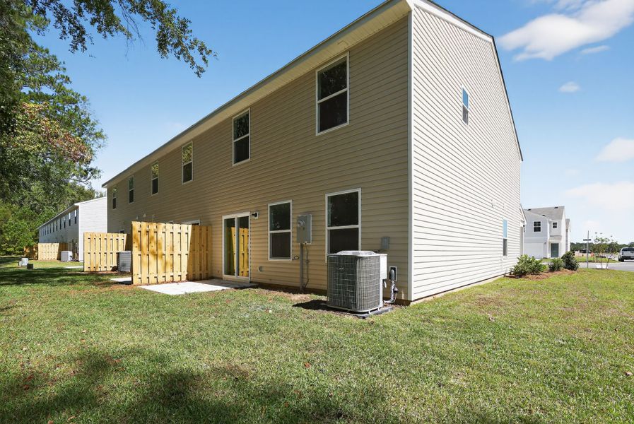 A white house with a fence.