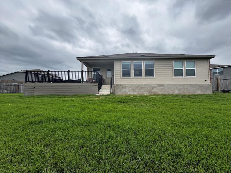 Large backyard with deck