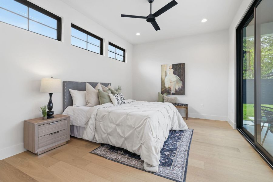 Bedroom with access to exterior, light wood-style floors, recessed lighting, and a ceiling fan