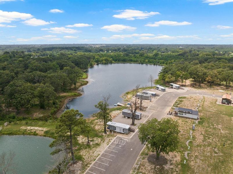 Bird's eye view of a nearby body of water and a forest
