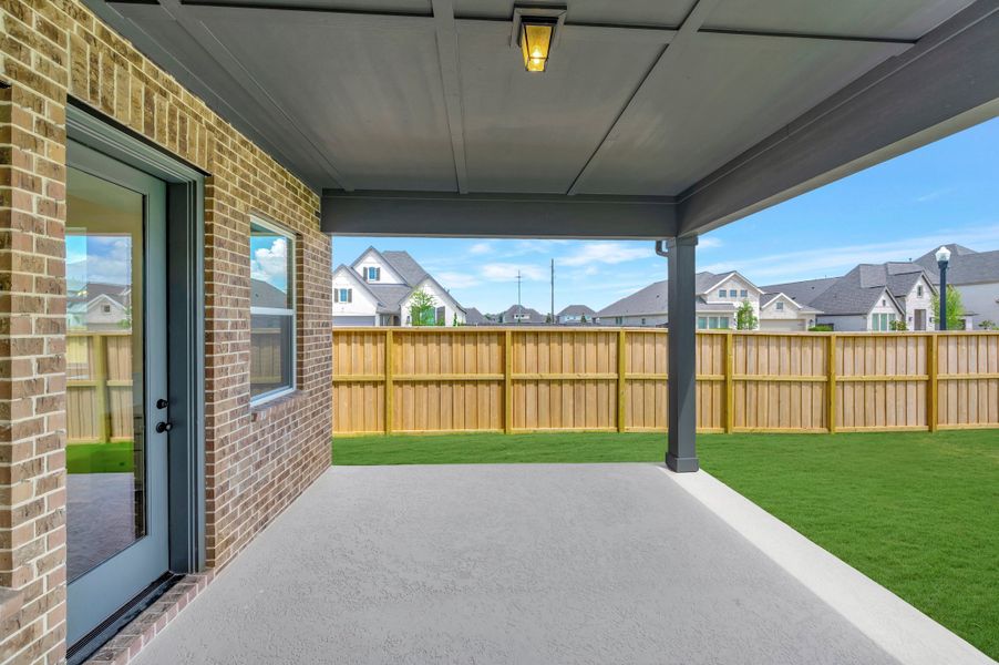 Exterior details and patio area of a home in Riceland - Enclave Collection, Mont Belvieu (Image 4). Exterior details and patio area of a home in Riceland - Enclave Collection, Mont Belvieu (Image 4).