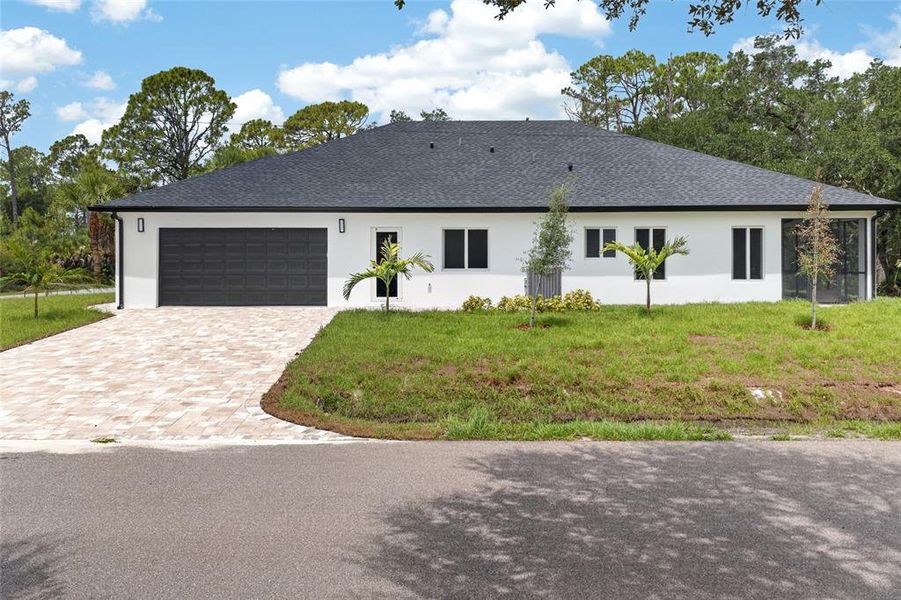 Front exterior of a new home in , Port Charlotte, FL, highlighting curb appeal (Image 24). Front exterior of a new home in , Port Charlotte, FL, highlighting curb appeal (Image 24).