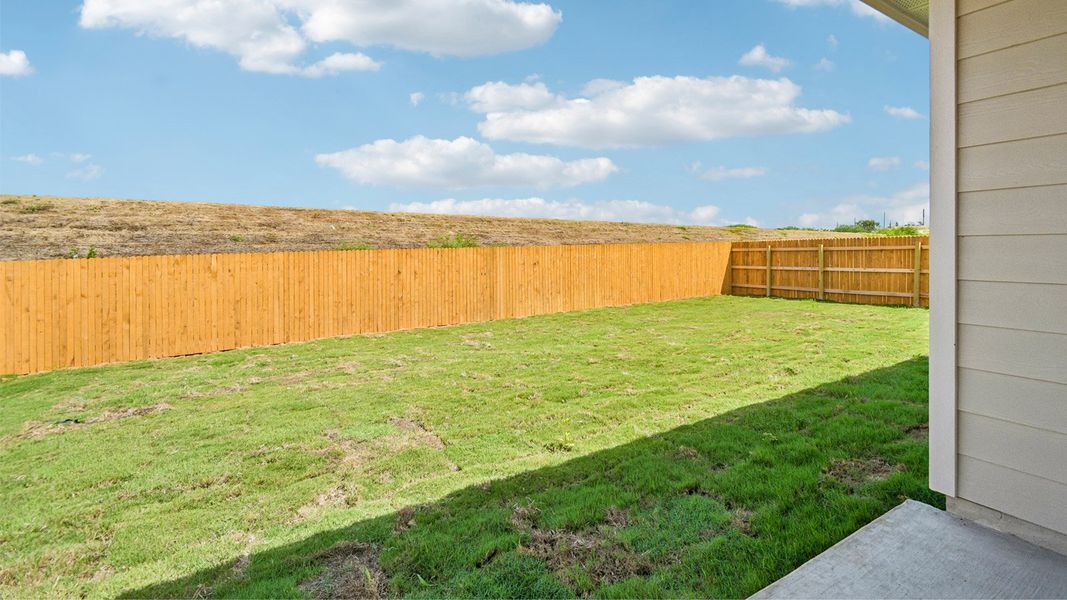 Exterior details and patio area of a home in Prairie Lakes, Buda (Image 20).