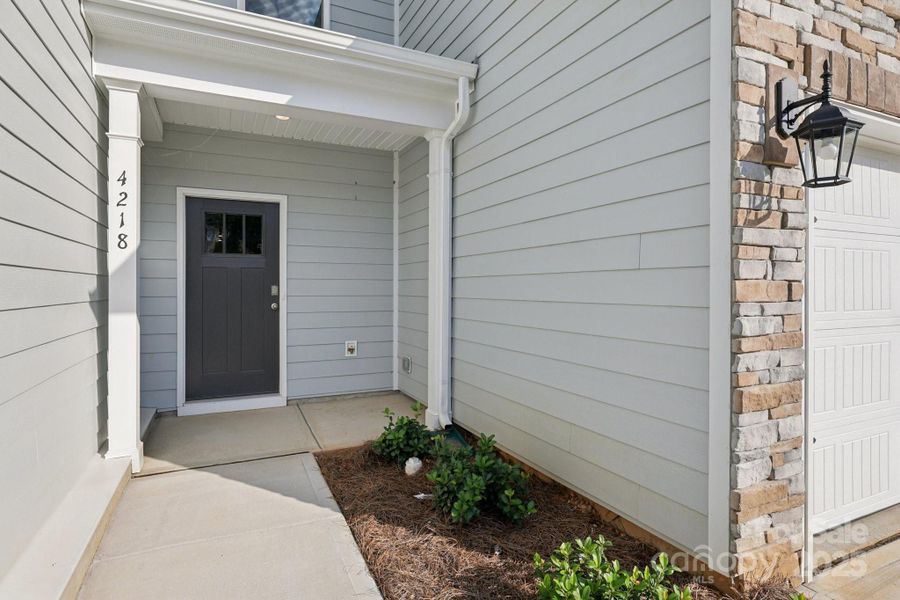 Front exterior of a new home in Blackstone Bay Townhomes, Sherrills Ford, NC, highlighting curb appeal (Image 2).