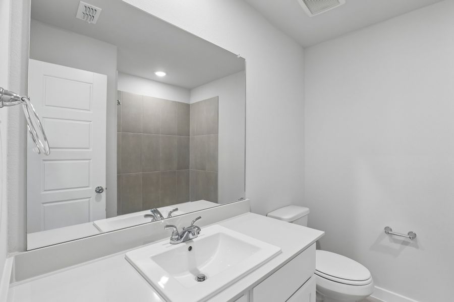 Secondary Bathroom in the Holden home plan by Trophy Signature Homes