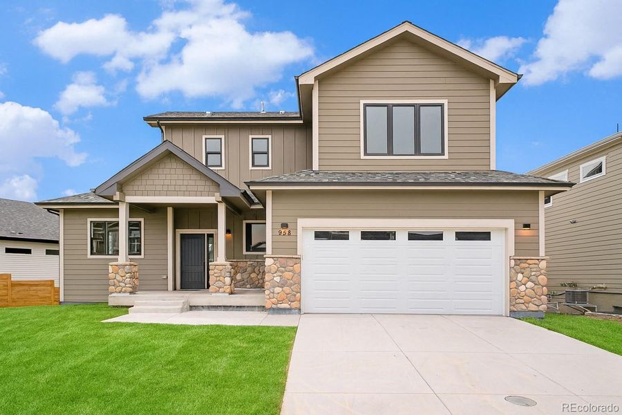 Front exterior of a new home in , Louisville, CO, highlighting curb appeal (Image 1).
