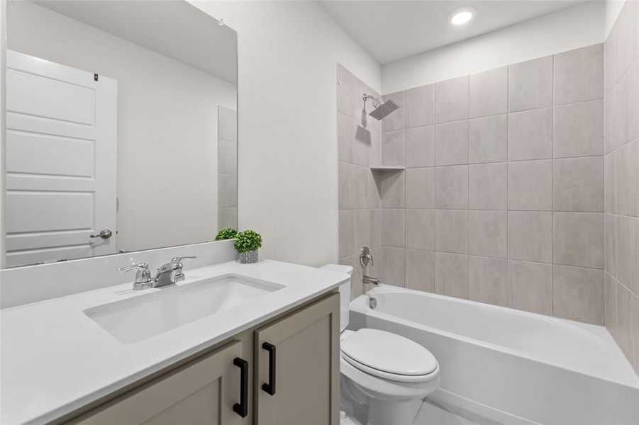 Bathroom featuring vanity and bathtub / shower combination Bathroom featuring vanity and bathtub / shower combination
