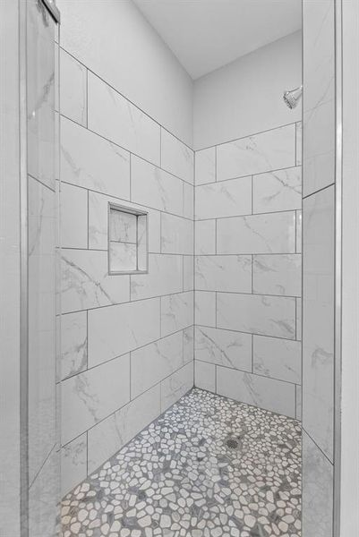 Bathroom featuring a shower stall