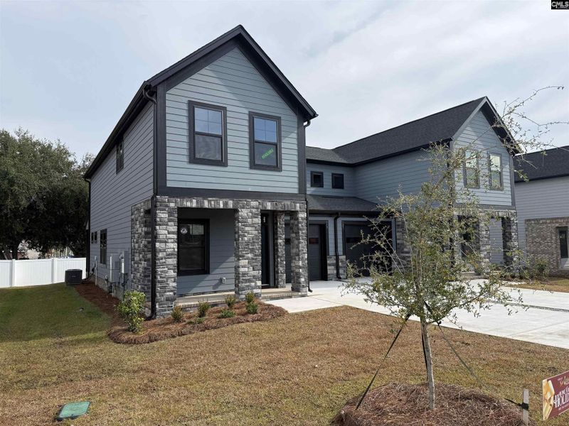 Front exterior of a new home in Dunbar Village, Cayce, SC, highlighting curb appeal (Image 29). Front exterior of a new home in Dunbar Village, Cayce, SC, highlighting curb appeal (Image 29).