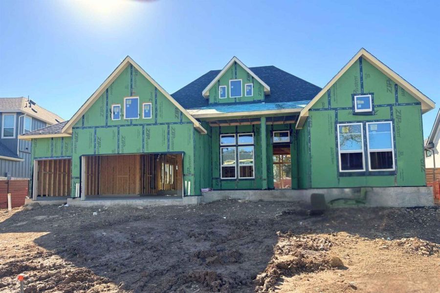 View of front of property featuring covered porch, a garage, and a shingled roof View of front of property featuring covered porch, a garage, and a shingled roof