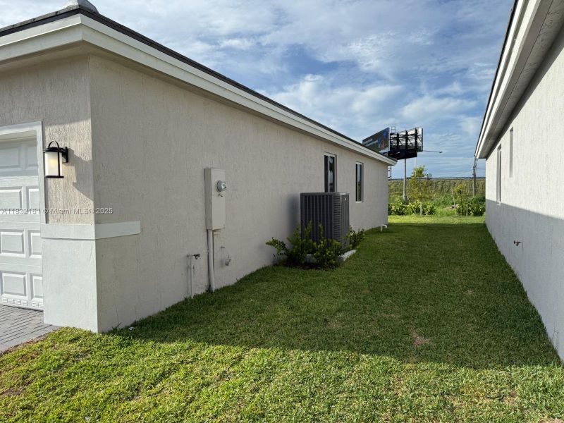 Front exterior of a new home in , Homestead, FL, highlighting curb appeal (Image 14). Front exterior of a new home in , Homestead, FL, highlighting curb appeal (Image 14).