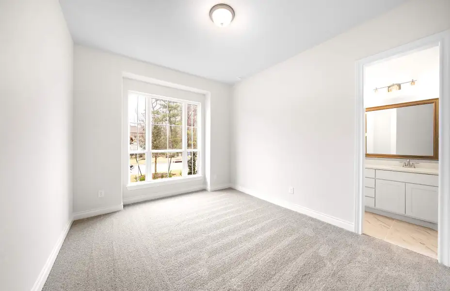 Representative unfurnished interior of a home built from the 3068 by Ravenna Homes in The Woodlands Hills 65′, Willis (Image 41).