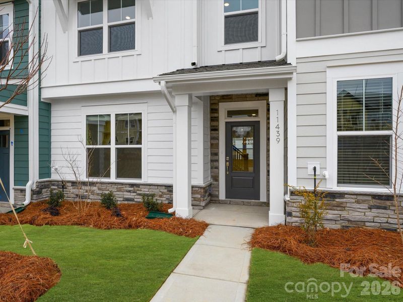 Exterior details and patio area of a home in North Creek Village, Huntersville (Image 4).