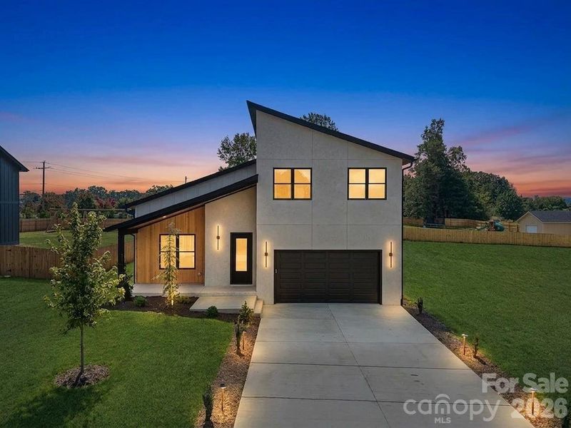 Front exterior of a new home in , Flat Rock, NC, highlighting curb appeal (Image 1). Front exterior of a new home in , Flat Rock, NC, highlighting curb appeal (Image 1).