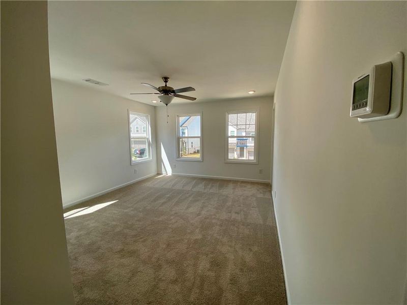 Spacious, unfurnished interior of a new home in Eastlyn Crossing, Flowery Branch (Image 22).