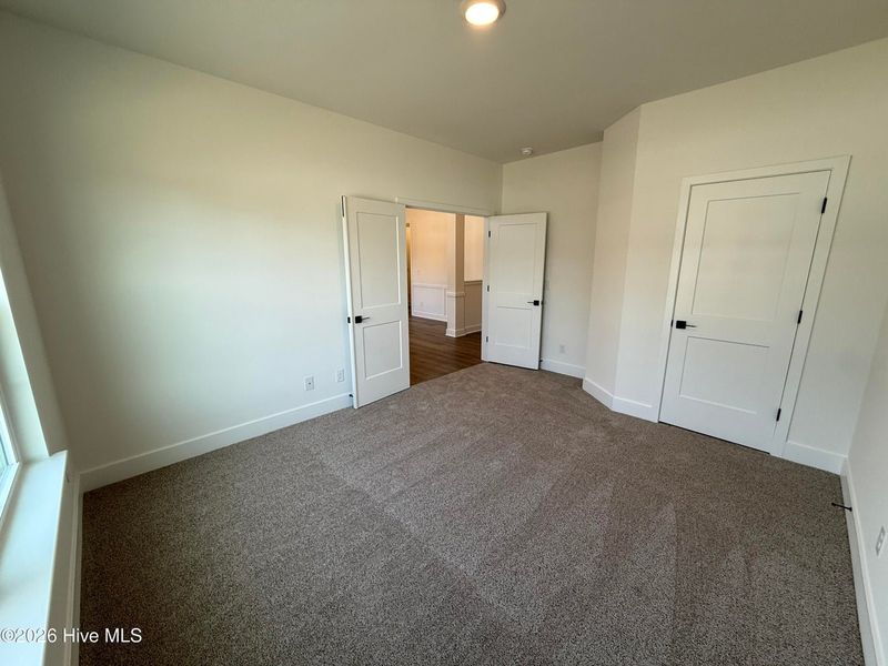 Spacious, unfurnished interior of a new home in Wood Creek Landing, Leland (Image 22).