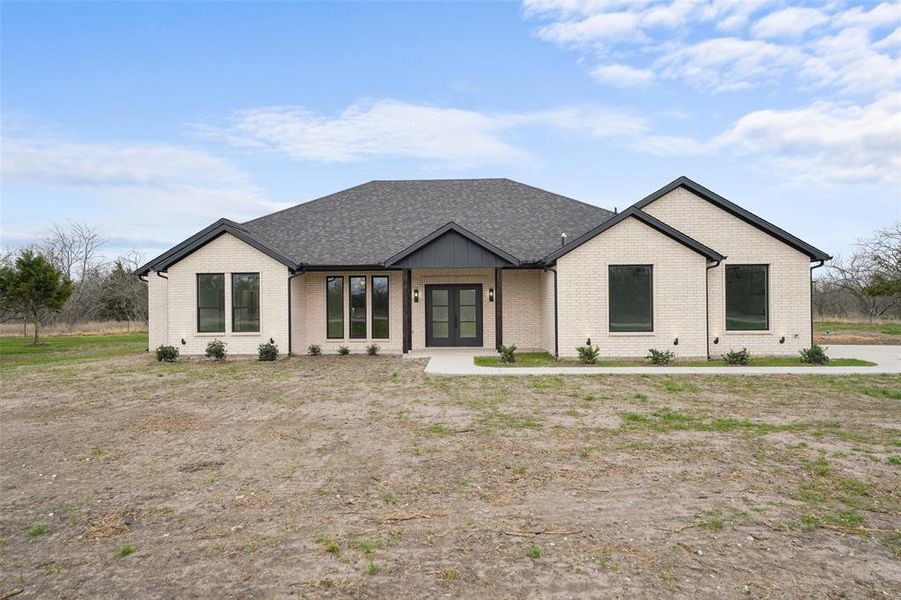 Front exterior of a new home in , Corsicana, TX, highlighting curb appeal (Image 23).