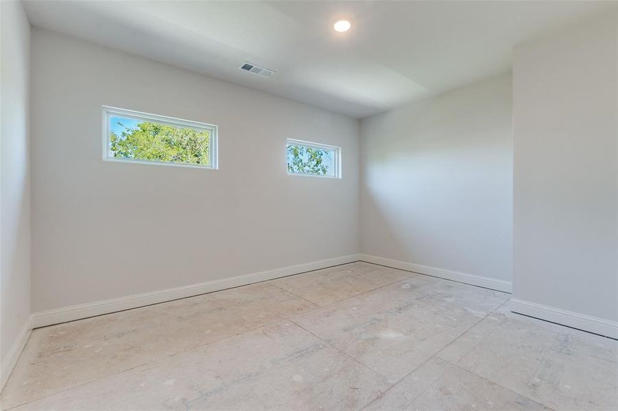 Unfurnished room with baseboards Unfurnished room with baseboards