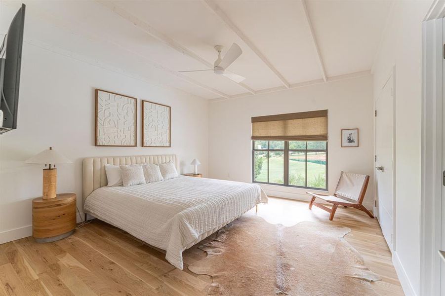 Bedroom featuring wood finished floors, a ceiling fan, a closet, and beam ceiling Bedroom featuring wood finished floors, a ceiling fan, a closet, and beam ceiling