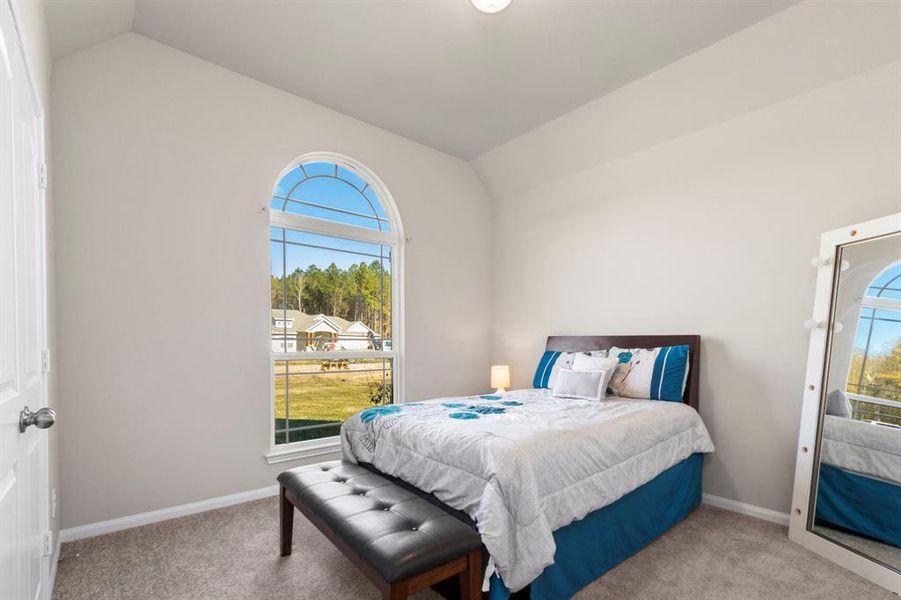 Guest bedroom with full bathroom right next door to it.