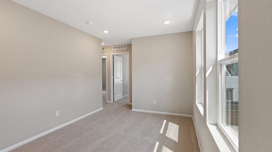 Spacious, unfurnished interior of a new home in Woodrose at Painted Prairie, Aurora (Image 11).