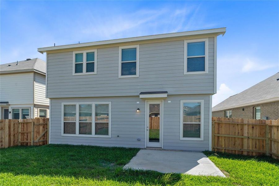 Come and see this spacious backyard with its beautiful covered patio. There is plenty of room for the kids to play and adults to relax!