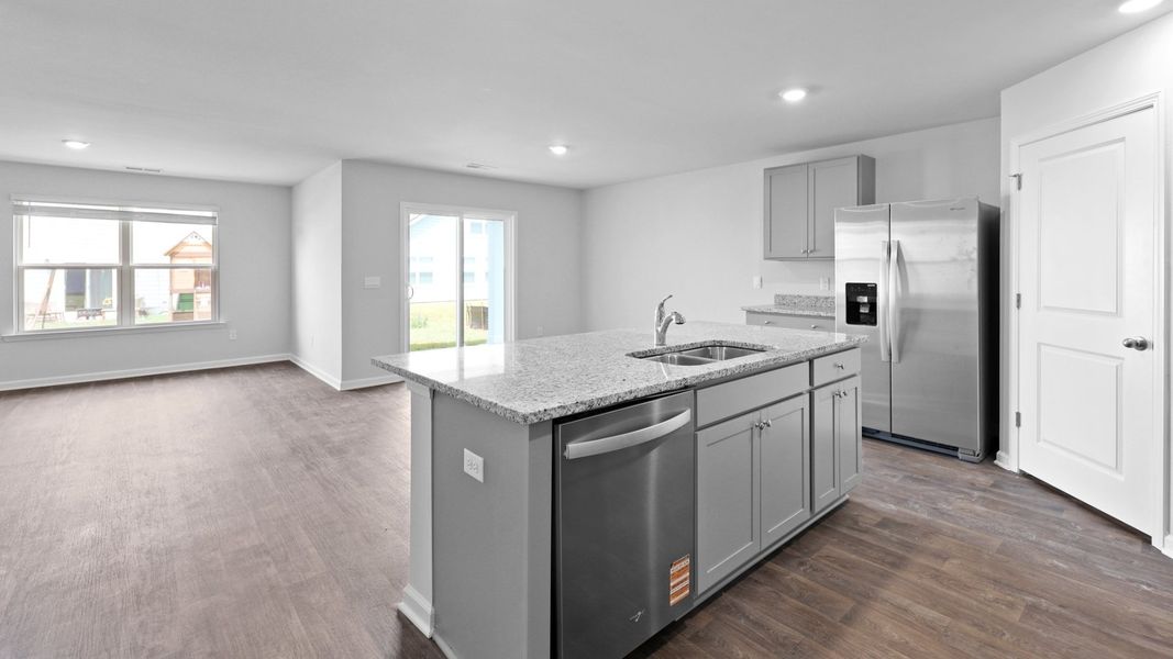 Representative furnished interior of a home built from the Cali by D.R. Horton in Center Pointe, Santee (Image 4).