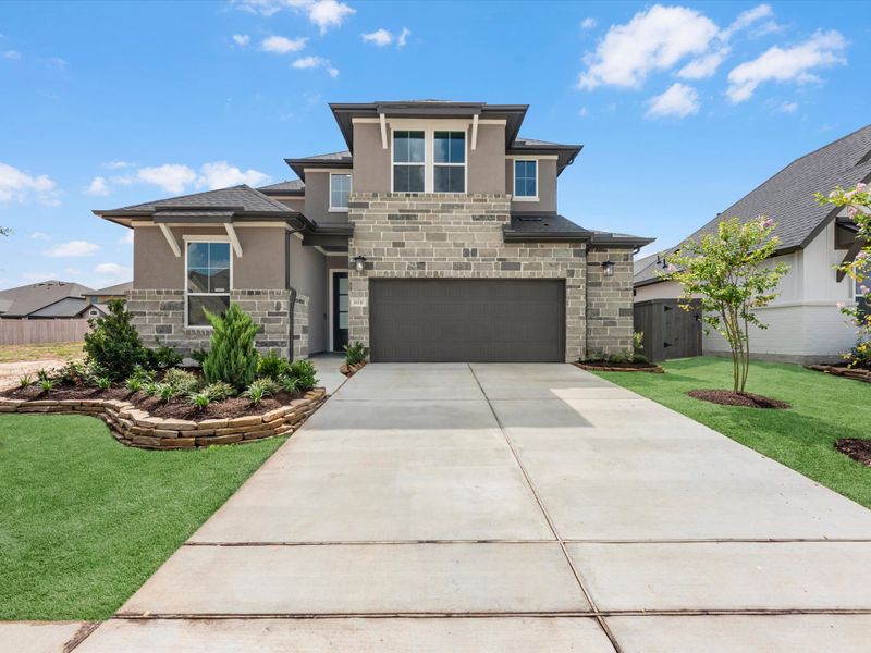 Front exterior of a new home in Jubilee 50′, Hockley, TX, highlighting curb appeal (Image 16).
