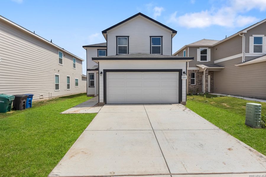 Front exterior of a new home in Medina Crossing, Von Ormy, TX, highlighting curb appeal (Image 19).