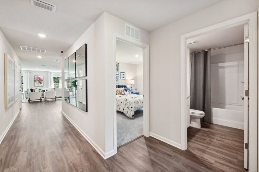 A bathroom with a large mirror.