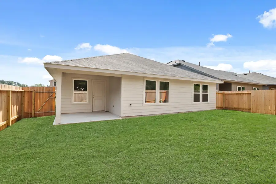 Exterior details and patio area of a home in Grand Pines, Magnolia (Image 3).
