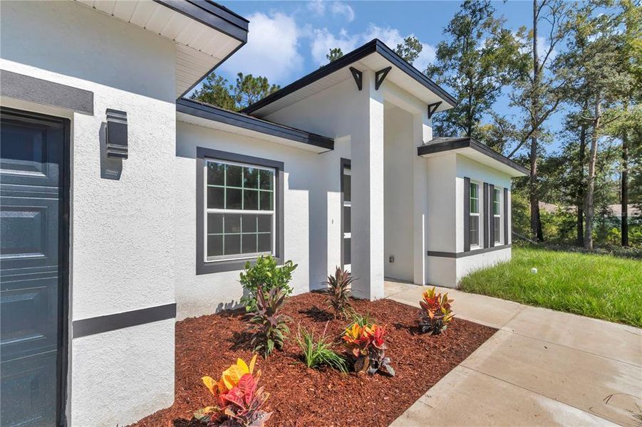 Front exterior of a new home in , Citrus Springs, FL, highlighting curb appeal (Image 18).