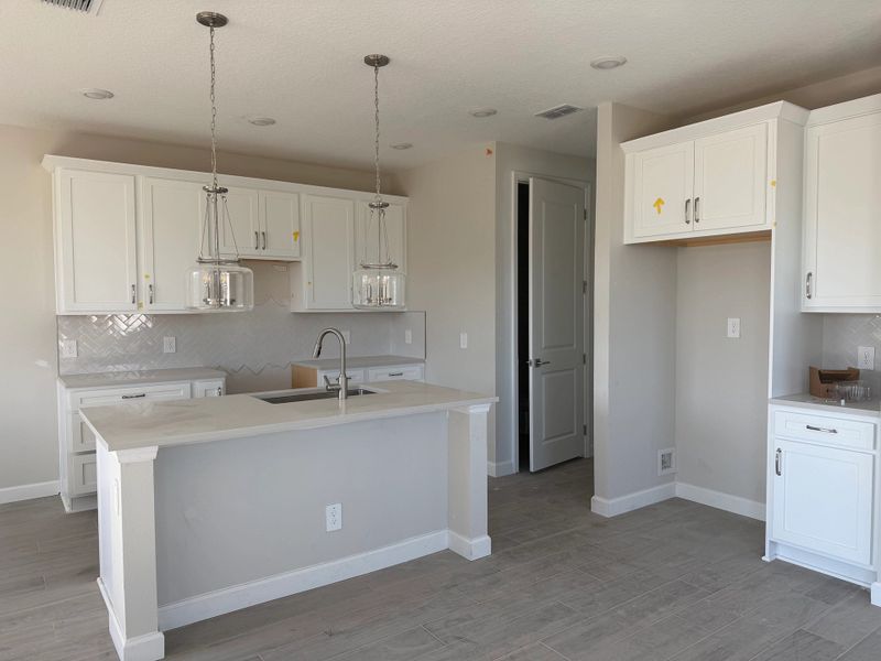 Elegant kitchen across from dining space, featuring the AW Timeless Collection Elegant kitchen across from dining space, featuring the AW Timeless Collection