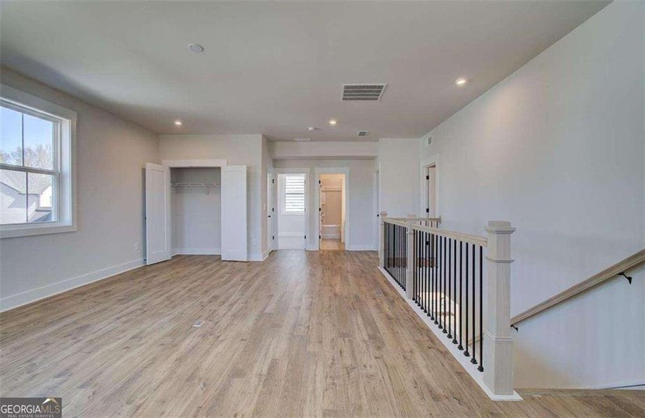 Spacious, unfurnished interior of a new home in The Paddocks at Doc Hughes, Buford (Image 36).