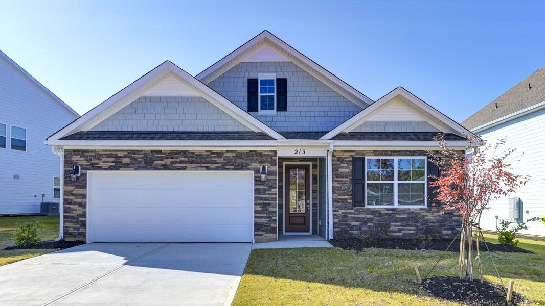 Front exterior of a new home in Livingston Woods, Irmo, SC, highlighting curb appeal (Image 1).